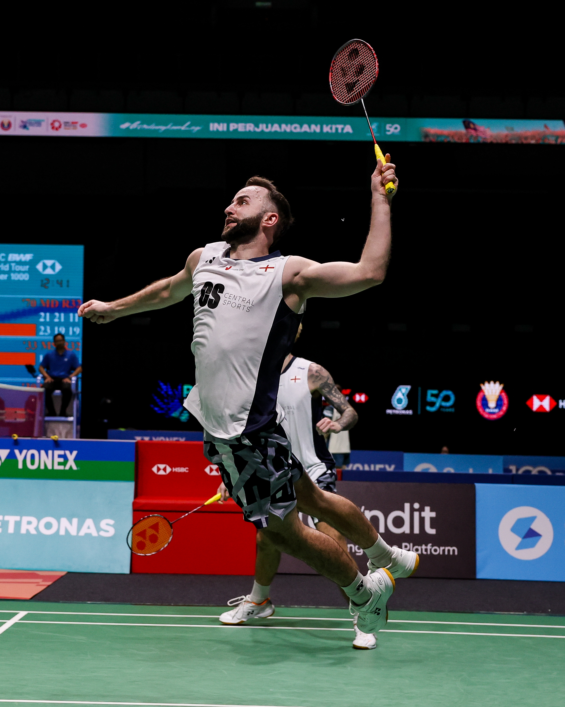 Hero — badminton player celebrating on court, England kit