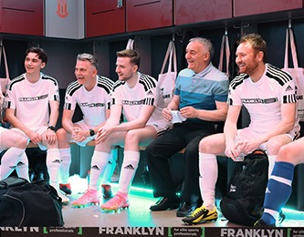 Team — players seated in changing room
