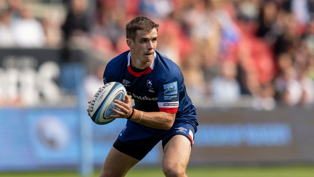 Hero — rugby player carrying the ball in blue kit