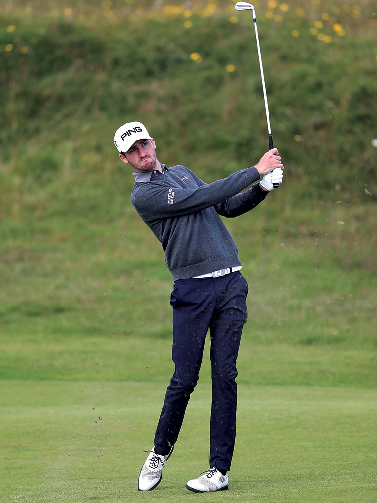 Hero — golfer mid-swing on the fairway