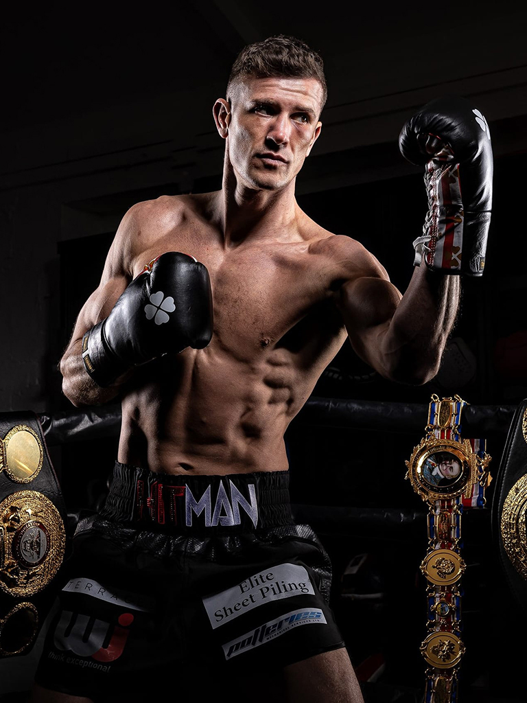Nathan Heaney with championship belts