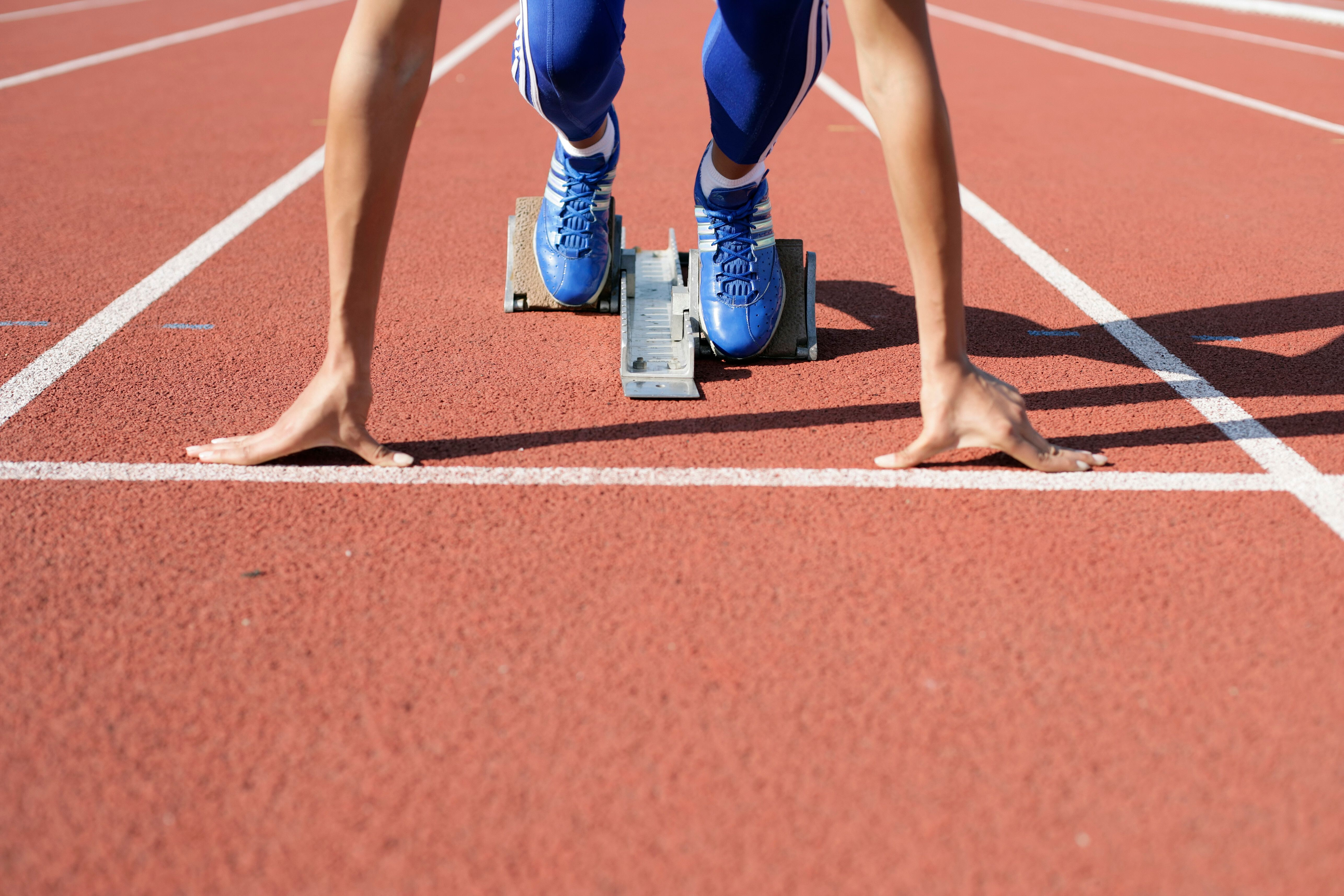 Hero — sprinter’s feet in the starting blocks