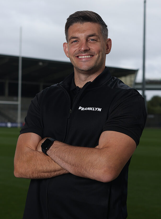 Will Cliff portrait, arms folded, pitchside