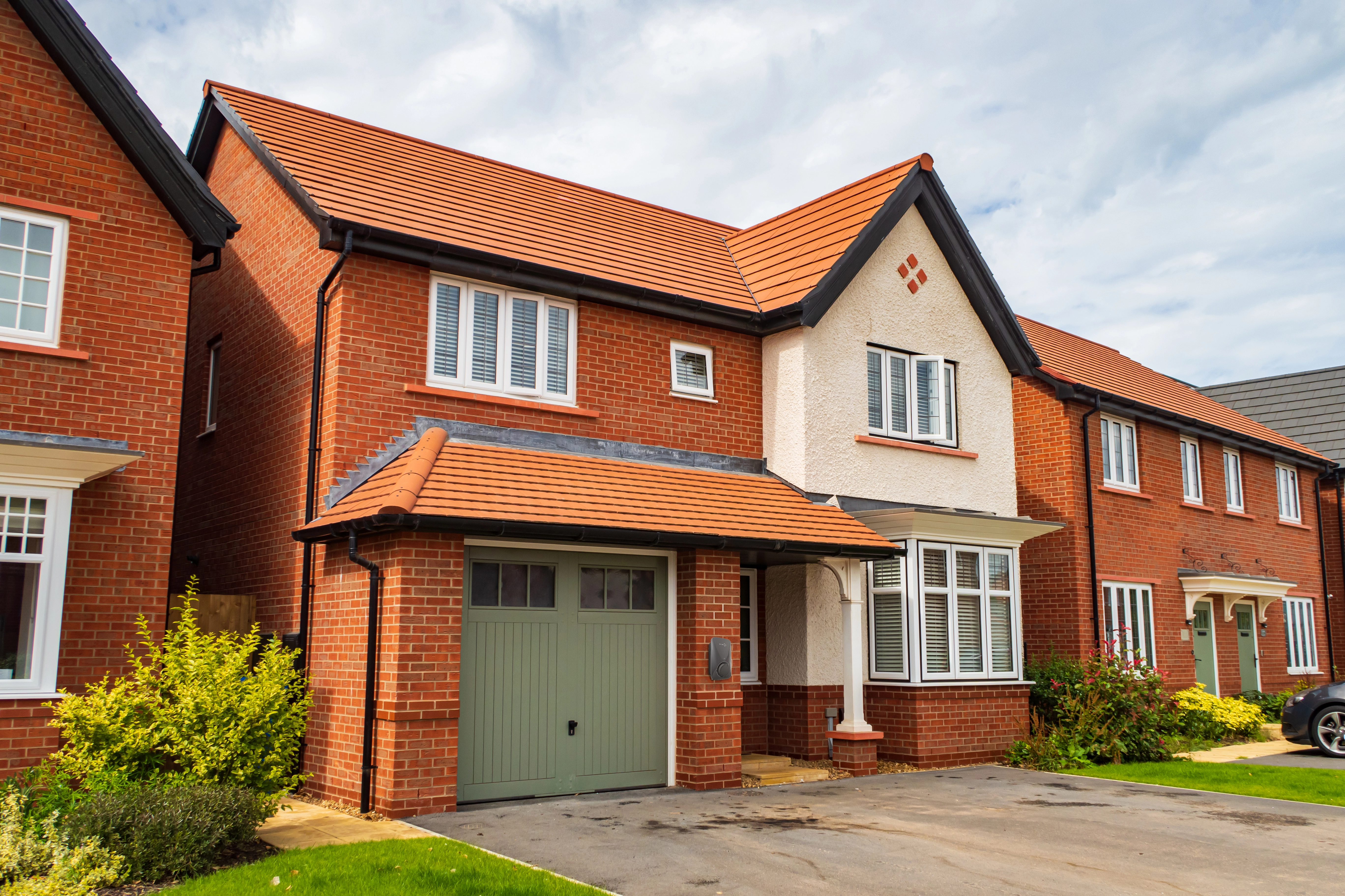 Solar panels installed on residential building and garage roof generating renewable energy