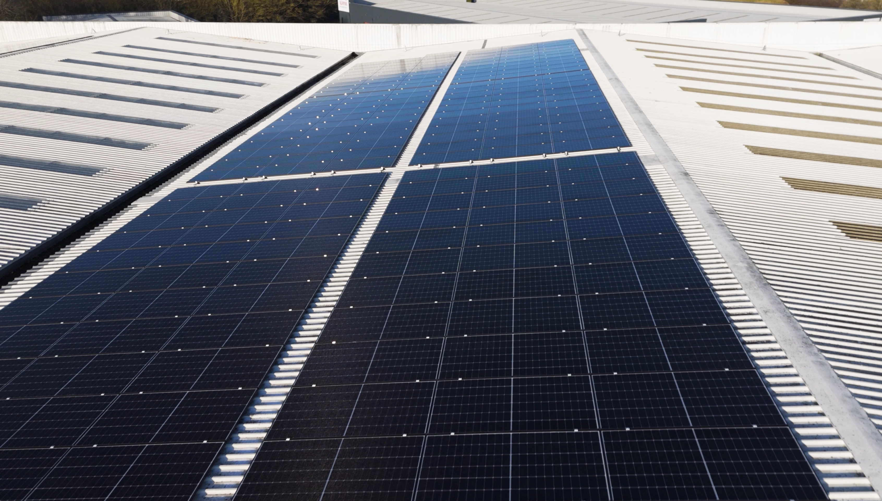 Close-up of solar panels installed on a commercial rooftop generating renewable energy
