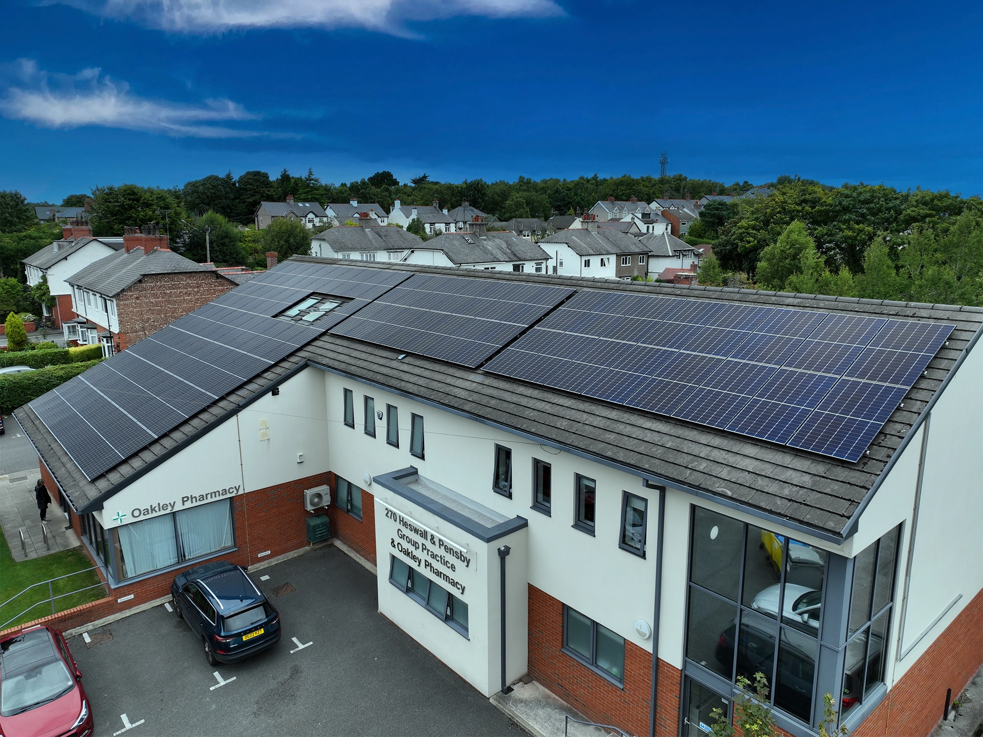 Solar panels installed on a commercial building roof, providing renewable energy for a pharmacy and healthcare facility