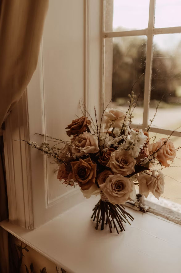 A bouquet on a window ledge